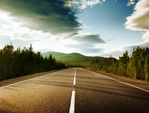 depositphotos_6450708-stock-photo-sunset-on-the-road.jpg